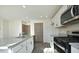 Modern kitchen with granite countertops and stainless steel appliances at 139 Palm Drive Dr, Sanford, NC 27332