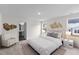The main bedroom features carpet, neutral paint, an ensuite bathroom, and natural light at 141 Gladstone Loop, Clayton, NC 27520
