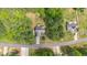 Aerial view showcasing the property's placement amongst lush greenery in neighborhood at 175 Grist Mill Dr, Franklinton, NC 27525