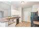 Kitchen featuring granite countertops, stainless steel appliances, and an open view to the dining area at 175 Grist Mill Dr, Franklinton, NC 27525