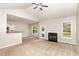 Spacious living room features vaulted ceilings, a cozy fireplace, and access to the outdoor deck at 175 Grist Mill Dr, Franklinton, NC 27525