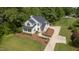 Aerial view of home showcasing its architectural design, landscaping, and curb appeal at 1925 W Lake Dr, Burlington, NC 27215