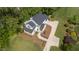 Aerial view of house showing landscaping, driveway, and deck at 1925 W Lake Dr, Burlington, NC 27215