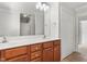 Bathroom featuring a double sink vanity, and a closet nearby at 1925 W Lake Dr, Burlington, NC 27215