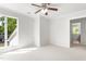 Bright bedroom with neutral carpet, light walls, and windows providing natural light at 1925 W Lake Dr, Burlington, NC 27215