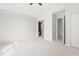 Bedroom with neutral carpet and doorway leading to other rooms at 1925 W Lake Dr, Burlington, NC 27215