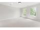 Spacious bedroom with carpet, and natural light at 1925 W Lake Dr, Burlington, NC 27215