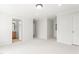 Neutral bedroom with carpet leading to the bathroom at 1925 W Lake Dr, Burlington, NC 27215