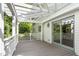 View of the gray deck with white pergola and railing of this home at 1925 W Lake Dr, Burlington, NC 27215