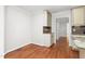Bright dining area adjacent to the kitchen featuring hardwood floors and built-in cabinet at 1925 W Lake Dr, Burlington, NC 27215