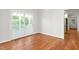 Open dining area with hardwood floors and French doors to an outdoor space at 1925 W Lake Dr, Burlington, NC 27215