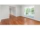 Open dining area with hardwood floors and French doors to an outdoor space at 1925 W Lake Dr, Burlington, NC 27215