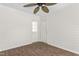 Hallway with two white doors and complementary wood-look floors at 1925 W Lake Dr, Burlington, NC 27215