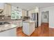 A well-lit kitchen with granite countertops, stainless appliances, and center island at 1925 W Lake Dr, Burlington, NC 27215