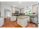 Bright kitchen with granite countertops, stainless appliances, and center island at 1925 W Lake Dr, Burlington, NC 27215