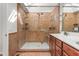 Bathroom featuring a glass shower, shower head, and tiled walls at 1925 W Lake Dr, Burlington, NC 27215