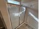 The bathroom features a modern glass-enclosed shower with tiled walls and a convenient door at 202 E Victory View Ter, Smithfield, NC 27577