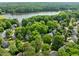Lush community with lake views features tree-lined streets and well-maintained homes at 206 Swiss Lake Dr, Cary, NC 27513