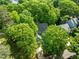 Aerial view of the home showing mature trees at 206 Swiss Lake Dr, Cary, NC 27513