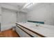 Bright bathroom with double sinks, white cabinets, and tiled shower at 206 Swiss Lake Dr, Cary, NC 27513