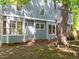 Exterior side view of home featuring a bay window at 206 Swiss Lake Dr, Cary, NC 27513