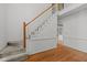 Bright foyer with hardwood floors, a staircase with white railing, and neutral wall paint at 206 Swiss Lake Dr, Cary, NC 27513