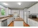 Well-equipped kitchen with an island, abundant storage, and modern appliances at 206 Swiss Lake Dr, Cary, NC 27513