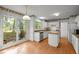 Bright kitchen showcasing an island, stainless steel appliances, and natural light at 206 Swiss Lake Dr, Cary, NC 27513