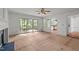 Bright living room featuring sliding doors to deck, recessed lighting, and access to kitchen at 206 Swiss Lake Dr, Cary, NC 27513