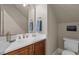 Bathroom featuring modern fixtures, and a wooden vanity at 213 Old Franklin Grove Dr, Chapel Hill, NC 27514
