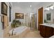 Relaxing bathroom features a jacuzzi tub and a glass-enclosed shower at 213 Old Franklin Grove Dr, Chapel Hill, NC 27514