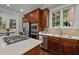 Bright kitchen featuring stainless steel appliances, hardwood floors, and a large window for natural light at 213 Old Franklin Grove Dr, Chapel Hill, NC 27514