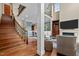 Bright living room boasts a cozy fireplace, large windows, and comfortable seating at 213 Old Franklin Grove Dr, Chapel Hill, NC 27514