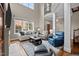 Bright living room boasts a cozy fireplace, large windows, and comfortable seating at 213 Old Franklin Grove Dr, Chapel Hill, NC 27514