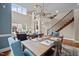 Inviting living space with a dining area, a staircase, and comfortable seating at 213 Old Franklin Grove Dr, Chapel Hill, NC 27514
