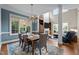 Open-concept living space with a dining area, high ceilings, and an abundance of natural light at 213 Old Franklin Grove Dr, Chapel Hill, NC 27514