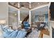 Spacious living area with a loft, dining area, comfortable seating, and a fireplace at 213 Old Franklin Grove Dr, Chapel Hill, NC 27514