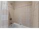 Shower and tub featuring tan-colored tile at 213 Old Franklin Grove Dr, Chapel Hill, NC 27514