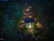 Night aerial showcasing estate home with illuminated landscape and mature tree coverage at 220 Glandon Dr, Chapel Hill, NC 27514