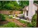 Beautiful backyard patio with outdoor furniture and lush garden surroundings, ideal for outdoor enjoyment at 220 Glandon Dr, Chapel Hill, NC 27514
