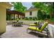 Spacious patio featuring lounge chairs, a dining set, and a pergola, ideal for outdoor enjoyment at 220 Glandon Dr, Chapel Hill, NC 27514