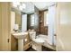 Neutral tiled bathroom with a white shower curtain and a pedestal sink at 220 Glandon Dr, Chapel Hill, NC 27514