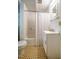 Compact bathroom featuring tiled floors, a vanity, and a shower-tub combination at 220 Glandon Dr, Chapel Hill, NC 27514