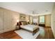 Spacious bedroom featuring hardwood floors, detailed wallpaper and a ceiling fan at 220 Glandon Dr, Chapel Hill, NC 27514