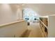 Carpeted bonus room with a vaulted ceiling and two twin beds at 220 Glandon Dr, Chapel Hill, NC 27514