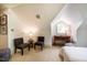 Attic bedroom with neutral carpet and two chairs at 220 Glandon Dr, Chapel Hill, NC 27514