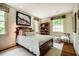 Bedroom featuring hardwood floors, custom window coverings, and natural lighting at 220 Glandon Dr, Chapel Hill, NC 27514