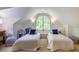 Vaulted bonus room with a carpet, twin beds, and sitting area at 220 Glandon Dr, Chapel Hill, NC 27514