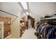 Walk-in closet featuring skylights and custom shelving and rods at 220 Glandon Dr, Chapel Hill, NC 27514
