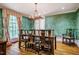 Dining room with large table, traditional chairs, unique wallpaper, and natural light at 220 Glandon Dr, Chapel Hill, NC 27514